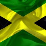 De vlag van Jamaica zul je veel zien als je op vakantie gaat naar Jamaica
